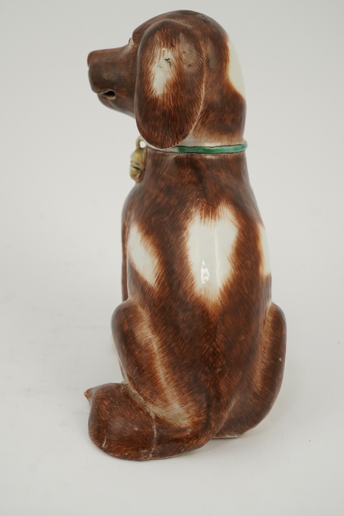 A Chinese export enamelled porcelain model of a seated spaniel, Qianlong period